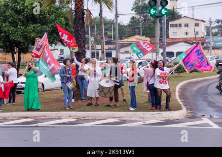 Goiânia, Goias, Brazil – October 21, 2022: Several people in action on the street with Lula's red flags. Stock Photo