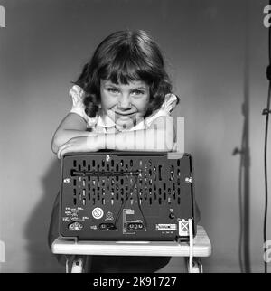 In the 1950s. A girl with a Philips radio set with the backside of the radio visible where the sockets for external antennas are placed.  Sweden 1959. Kristoffersson ref CG70-12 Stock Photo