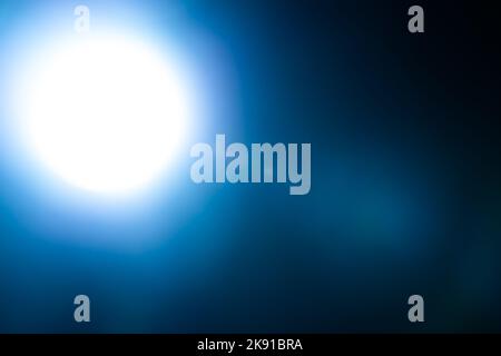 White lens flares overlay on black background. Spherical Optical Light leak. Stock Photo