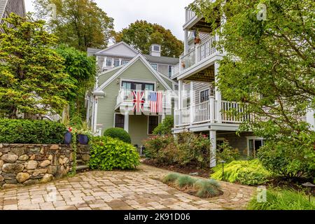 Plymouth, Massachusetts, USA - September 12, 2022: A courtyard where both the American and British flags are on display over a balcony. Stock Photo