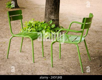 Dialogue. Two chairs facing each other in Tuileries garden. Paris ...