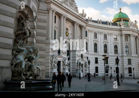 Colossal monumental sculptures of the Baroque Hofburg Palace in Vienna, Austria. Stock Photo