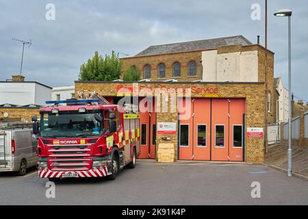 The Kent Fire and Rescue Service building with orange doors, red fire truck in front, ready to go in Margate, Thanet Stock Photo
