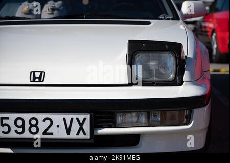 The detail of the third-generation white Honda Prelude old Japanese sports car, with folding headlights. Stock Photo