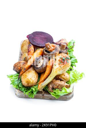 Oven  roasted vegetables with spices and herbs isolated on white Stock Photo