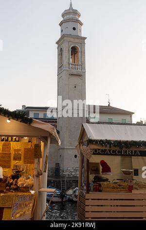 benches of the christmas market in the center of lazise at garda lake Stock Photo