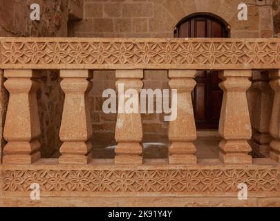 Deyrulzafaran Syriac or  Mor Hananyo Monastery. stone railing and stone carvings in the church. Mardin, Turkey 2022 Stock Photo