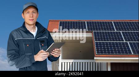 Engineer with tablet computer on a background of solar energy power station  Stock Photo