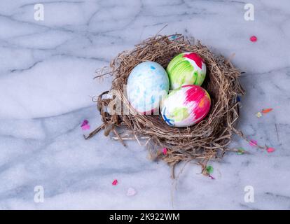 Graffiti filled Ester eggs in a nest Stock Photo