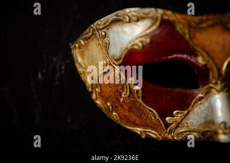 Vibrant VenetianVmask on dark background. Carnival mask. Stock Photo