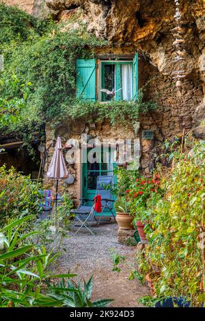 Travel destination, old village in hear of Provence Cotignac with famous cliffs with cave dwellings and troglodytes houses, Var, Provence, France Stock Photo