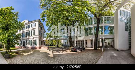 FRANKFURT, GERMANY - MAY 7, 2016: Museum of Applied Art and villa Metzeler as architectural combination in Frankfurt at schaumainkai area. Stock Photo