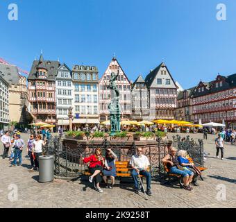 FRANKFURT, GERMANY - MAY 8, 2016: people visit Romerberg (Romerplatz) with old buildings  in Frankfurt. In the center stands the fountain of Justice, Stock Photo