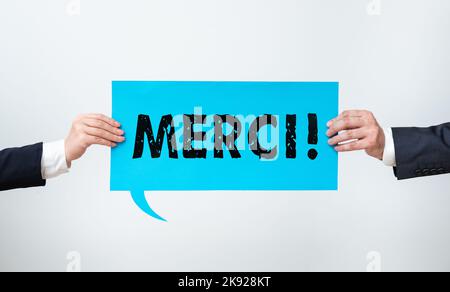 Conceptual caption Merci. Word Written on thank you in French what is said when someone helps you in France Stock Photo