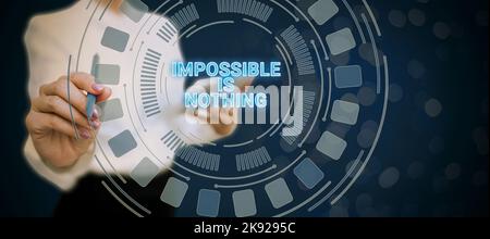 Conceptual caption Impossible Is Nothing. Word Written on Motivated to achieve something despite challenges Stock Photo