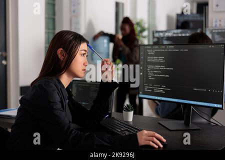 System engineer brainstorming ideas trying to write code and create new interface in big data room. Web developer programming server database in busy artificial intelligence developing agency. Stock Photo