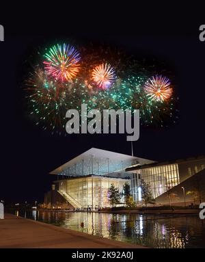 Building of SNFCC (Stavros Niarchos Foundation Cultural Center) located at Faliro, Athens, Greece. National Opera and Library at night with fireworks Stock Photo