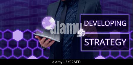 Conceptual display Developing Strategy. Word for Powerful Ways to Connect Online Global High Definition Man With Tablet And Digital Patterns Showing Stock Photo