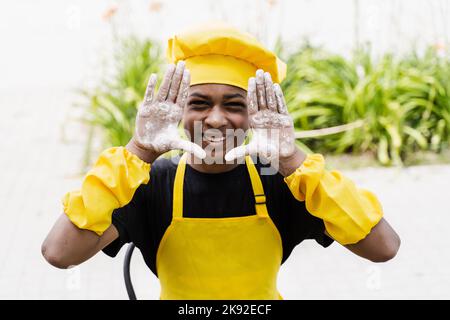 African children cooks in chefs hat and yellow uniforms grimacing and  showing tongue each others. African teenager and black girl have fun and  cook fo Stock Photo - Alamy