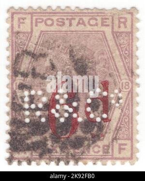 UNITED KINGDOM - 1883: An 6 pence on 6 pence violet postage stamp showing portrait of Queen Victoria surcharged in Carmine and perforated 'R&Co' Stock Photo