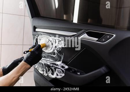 Premium Photo  Process of steam cleaning inside handle of car