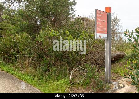 A sign for the Lifeline suicide prevention crisis hotline at The Gap in Watson's Bay, Sydney, Australia Stock Photo