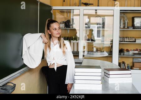 Pretty elementary school girl posing at camera Stock Photo - Alamy