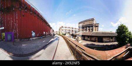 Voelklingen, Germany - August 13, 2016: buildings with rails fot train at Volklingen Ironworks in Saar, Germany. The plant was in production until 198 Stock Photo