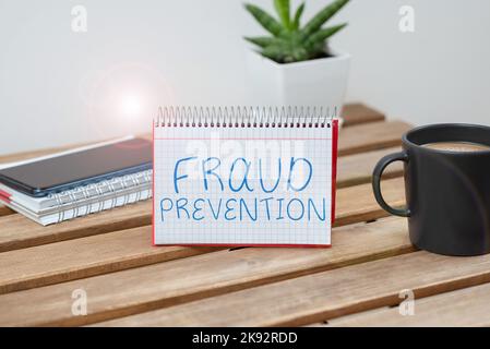 Hand writing sign Fraud Prevention. Word Written on to secure the enterprise and its processes against hoax Stock Photo