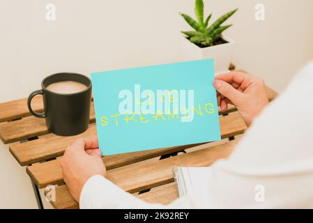 Writing displaying text Live Streaming. Internet Concept displaying audio or media content through digital devices Stock Photo