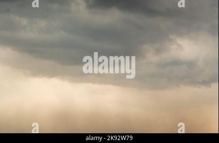 Dramatic Sky Background. Panoramic view of Stormy Clouds in Dark sky Stock Photo