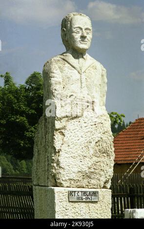 Harghita County, Romania, approx. 2001. Bust of Austro-Hungarian (born Romanian) writer Octavian Codru Tăslăuanu. Stock Photo