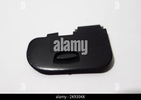 camera battery cover on white background Stock Photo