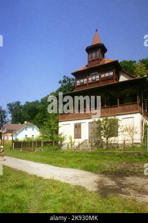 Harghita County, Romania, approx. 2002. Beautiful country house with several stories and large balcony. Stock Photo