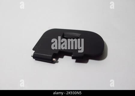 camera battery cover on white background Stock Photo