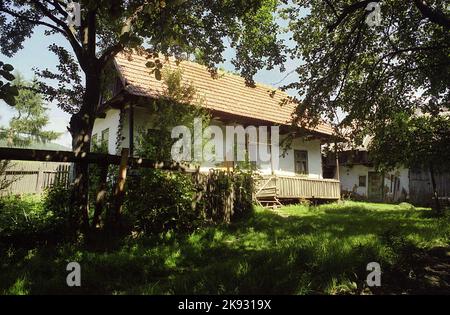 Harghita County, Romania, approx. 2001. Simple country house with wooden porch. Stock Photo
