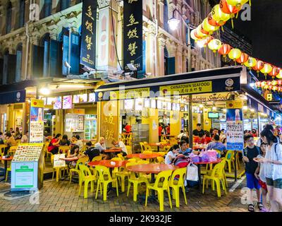 SINGAPORE, SINGAPORE - AUG 12, 2015: chinese people go eating in the evening in chinatown in Singapore . In 2014, 74 percent of the  Singapore populat Stock Photo