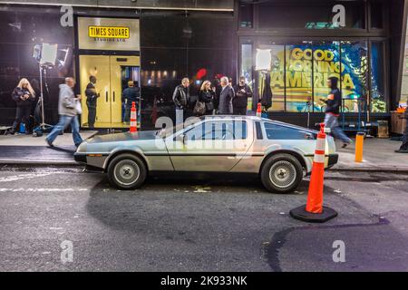 NEW YORK, USA - AUG 21, 2015: people admire the famous original amc chrome car from the film back to the future presented at time square due to 25th a Stock Photo