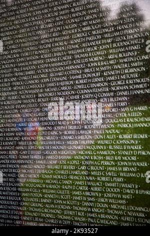 WASH DC -JULY 14: Names of Vietnam war casualties on Vietnam War Veterans Memorial on July 14,2010 in Washington DC, USA. Names in chronological order Stock Photo