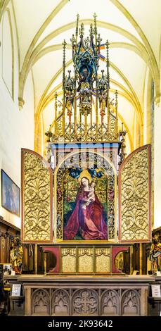 COLMAR, FRANCE - JULY 3, 2013: famous altar Madonna in a rose garden in Colmar, France. The altar was built by Martin Schongauer in 1473. Stock Photo