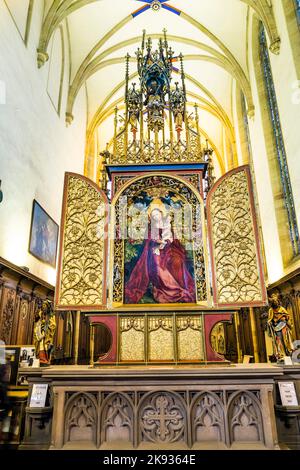 COLMAR, FRANCE - JULY 3, 2013: famous altar Madonna in a rose garden in Colmar, France. The altar was built by Martin Schongauer in 1473. Stock Photo