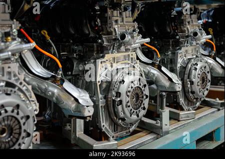 Car internal combustion engines stand on racks in warehouse Stock Photo