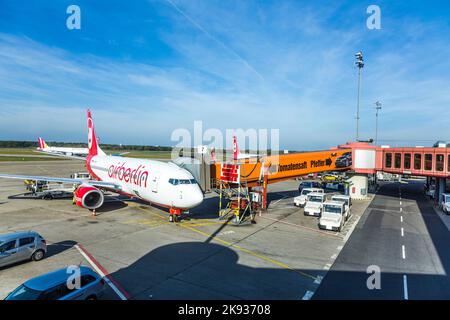 BERLIN, GERMANY - OCT 27, 2014: Air Berlin aircraft parks at the gate in  Tegel airport, Berlin, Germany. Homebase of Air Berlin is Tegel airport. Stock Photo