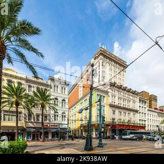 NEW ORLEANS - JULY 16, 2013: crossing canal street with bourbon street and famous Astor hotel in New Orleans, USA. The Astor Crown Plaza boasts of 693 Stock Photo