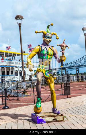 NEW ORLEANS - JULY 16, 2013: people at the creole Queen steam boat in New Orleans, USA. The Jester, symbol for Mardi Gras, stands in front. Stock Photo