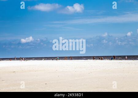 FORT MYERS BEACH, USA - JULY 27, 2013: Unknown people on a beach in Fort Myers Beach, USA. As of the census[  of 2010, there were 6,277 people in 3,44 Stock Photo