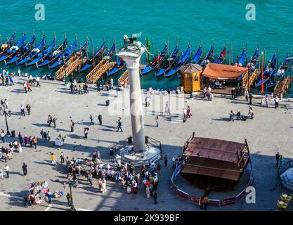VENICE, ITALY - APRIL 11, 2007: Gondolas wait for passengers at Plaza San marco  in Venice, Italy. There were several thousand gondolas in the 18th ce Stock Photo