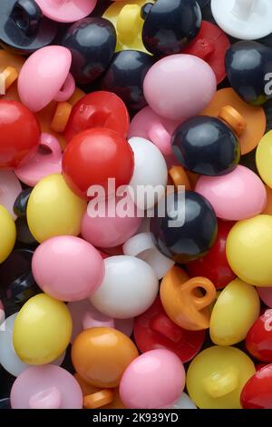 pile of colorful buttons, macro full frame background texture, close-up abstract