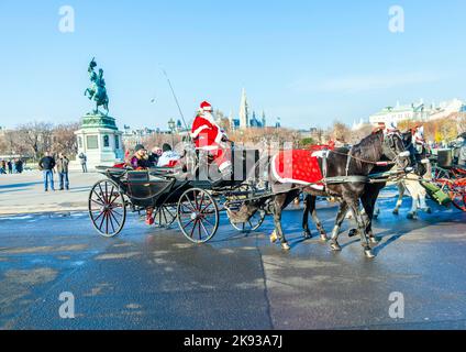 VIENNA, AUSTRIA - NOV 26: driver of the fiaker dressed as Santa Claus on November 26,2010 in Vienna, Austria. Since the 17th century, the horse-drawn Stock Photo