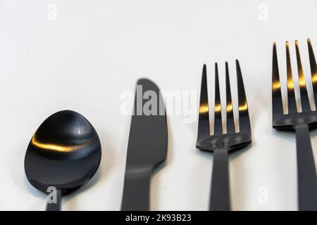 kitchen spoons and knives in black metal, mexico Stock Photo